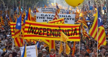 People hold banner reading "independence" during a protest for greater autonomy for Catalonia within Spain in Barcelona