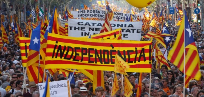 People hold banner reading "independence" during a protest for greater autonomy for Catalonia within Spain in Barcelona